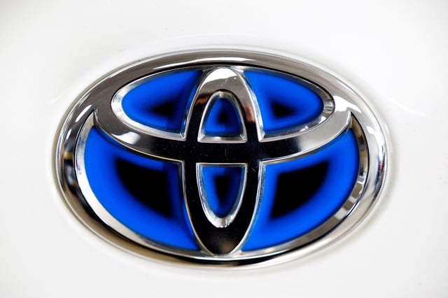 A logo of Toyota is seen inside a car dealer in Nijmegen, Netherlands February 26, 2025. REUTERS/Piroschka van de Wouw/File Photo