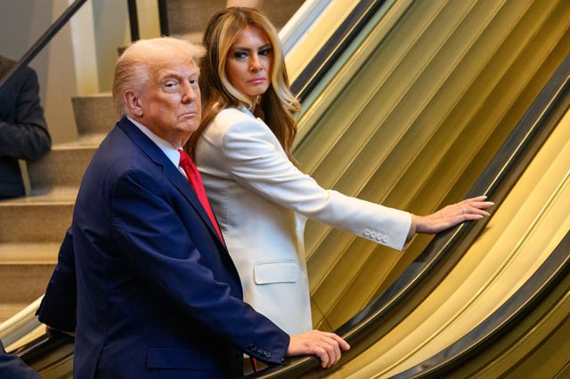 President Trump and first lady Melania Trump stall on an escalator at the United Nations in New York on Sept. 23, 2025.