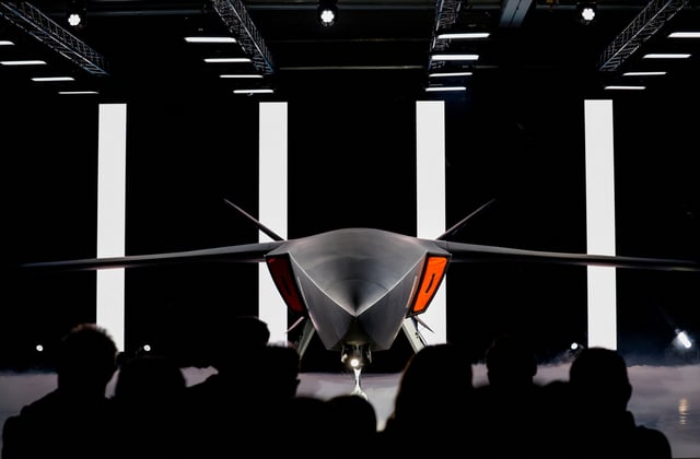 Attendees watch as the Helsing company presents a new air combat system CA-1 Europa in Tussenhausen, Germany, September 25, 2025. REUTERS/Michaela Stache