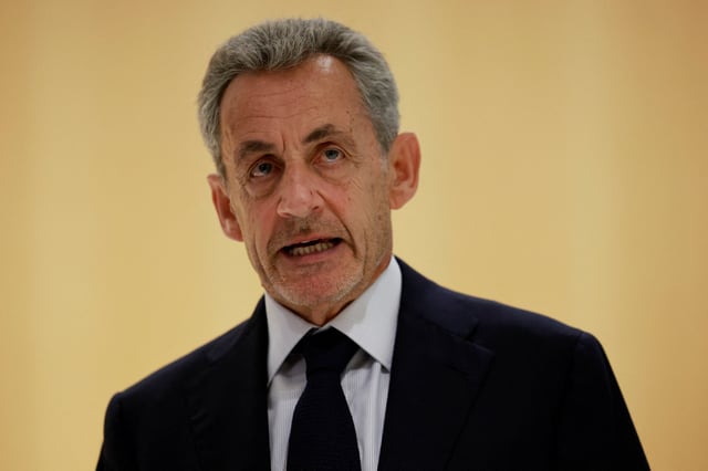 Former French President Nicolas Sarkozy talks to journalists after the verdict in his trial with other defendants on charges of corruption and illegal financing of an election campaign related to alleged Libyan funding of his successful 2007 presidential bid, at the courthouse in Paris, France, September 25, 2025. REUTERS/Stephanie Lecocq