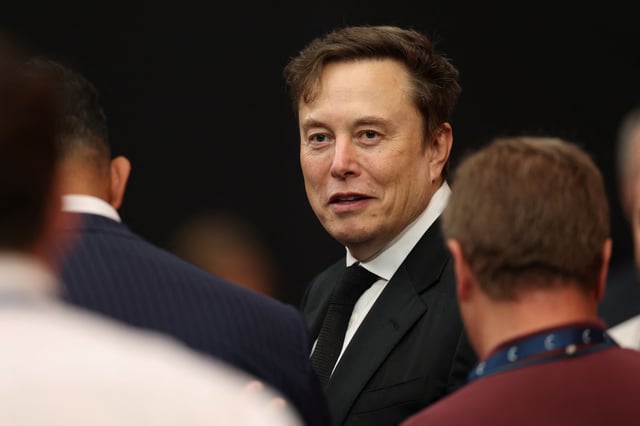 xAI CEO Elon Musk attends the public memorial service for right-wing activist Charlie Kirk at State Farm Stadium in Glendale, Arizona, on September 21, 2025.