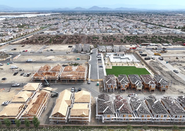 An aerial view of new residential housing under construction at a planned community on September 17, 2025 in Fontana, California. (Photo by Mario Tama/Getty Images)