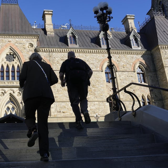 People make their way towards West block on Parliament Hill in Ottawa, Monday, Sept. 15, 2025. THE CANADIAN PRESS/Adrian Wyld