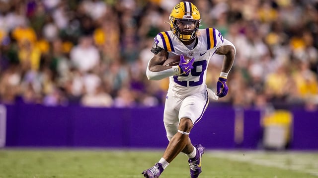 Sep 20, 2025; Baton Rouge, Louisiana, USA; LSU Tigers running back Caden Durham (29) runs against the Southeastern Louisiana Lions during the first half at Tiger Stadium. Mandatory Credit: Stephen Lew-Imagn Images