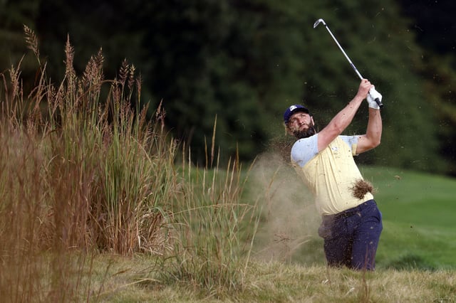 Sep 24, 2025; Bethpage, New York, USA; Jon Rahm plays from the rough on the 11th hole during a practice round of the Ryder Cup golf tournament at Bethpage Black. Mandatory Credit: Peter Casey-Imagn Images