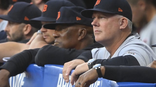 Sep 23, 2025; Cleveland, Ohio, USA; Detroit Tigers manager A.J. Hinch (14) watches from the dugout in the first inning against the Cleveland Guardians at Progressive Field. Mandatory Credit: David Richard-Imagn Images