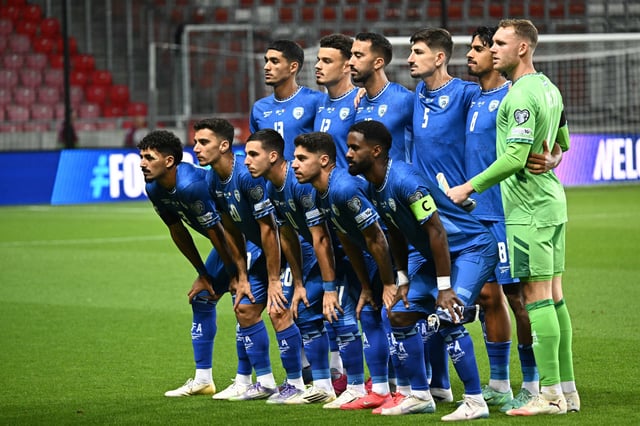 Israel's players line up for a picture prior to the World Cup qualifier against Italy.