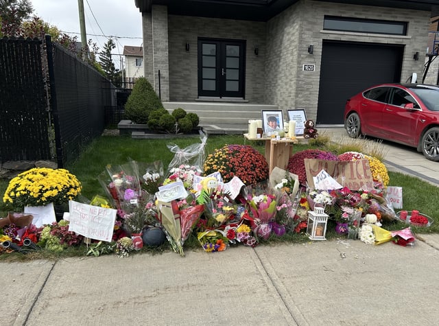 Flowers are left on the sidewalk in front of a home where a teenager was killed in an interaction with police in Longueuil, Que., south of Montreal on Wednesday Set. 24, 2025. Nooran Rezayi was killed on Sunday afternoon after police responded to a report of a group of armed people. THE CANADIAN PRESS/Sidhartha Banerjee