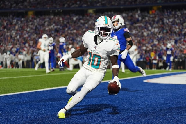 Dolphins receiver Tyreek Hill scores against the Bills on Sept. 18, 2025, in Orchard Park, N.Y. (AP Photo/Matt Rourke)
