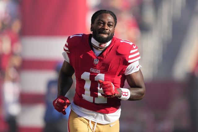 Sep 9, 2024; Santa Clara, California, USA; San Francisco 49ers wide receiver Brandon Aiyuk (11) is introduced to the crowd before the game against the New York Jets at Levi's Stadium. Mandatory Credit: Darren Yamashita-Imagn Images/File Photo