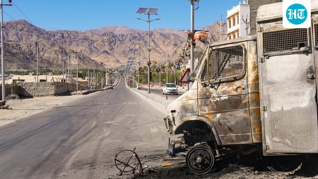 Charred remains of a vehicle lie in the aftermath of violent clashes between demonstrators and police during a protest demanding statehood for Ladakh, outside the BJP headquarters building, in Leh, Thursday, Sept. 25, 2025.