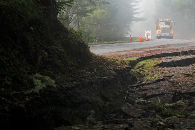 A crew with Humboldt County prepares to fill in cracks on a road Friday, Dec. 6, 2024, in Humboldt County, Calif. The cracks were caused by a 7.0 earthquake the day before.
