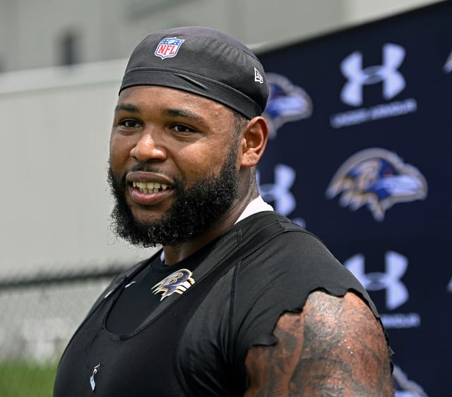 Ravens defensive end Travis Jones talks with the media after OTA work out at Under Armour Performance Center.(Kenneth K. Lam/Staff)