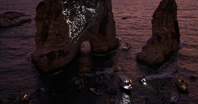 Beirut's landmark Raouche rock was illuminated by a portrait of late Hezbollah leader Hassan Nasrallah. AP