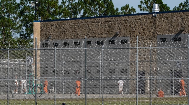 Detainees are seen in a yard at the Folkston ICE Processing Center on September 9, 2025, in Folkston, Georgia. A chartered plane will depart Seoul for the United States on September 10 to repatriate hundreds of South Korean workers detained in a sweeping immigration raid, flagcarrier Korean Air told AFP.
US immigration officials detained 475 people, including hundreds of South Korean workers, during a raid on September 4 at a Hyundai-LG battery plant being built in the southern state of Georgia. (Photo by Elijah Nouvelage / AFP) (Photo by ELIJAH NOUVELAGE/AFP via Getty Images)