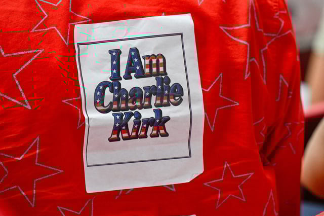 A supporter wears an "I am Charlie Kirk" shirt during a memorial service for slain conservative commentator Charlie Kirk at State Farm Stadium, in Glendale, Arizona, on Sept. 21, 2025.