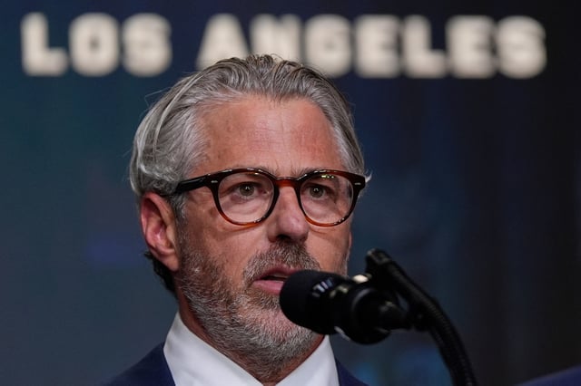 FILE - Casey Wasserman, chairman of LA28, speaks before President Donald Trump signs an executive order about the 2028 Los Angeles Olympic Games, in the South Court Auditorium of the Eisenhower Executive Office Building on the White House campus, Aug. 5, 2025, in Washington. (AP Photo/Julia Demaree Nikhinson, File)