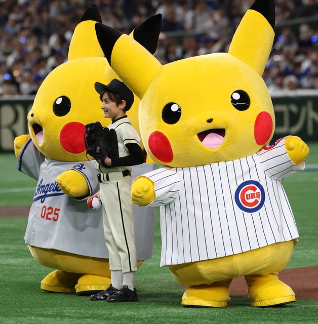 Pokémon characters wear Cubs and Dodgers jerseys for the opening day game game at the Tokyo Dome in March. Pokémon said this week it did not give permission for use of its intellectual property in a Homeland Security video. (JOHN J. KIM/CHICAGO TRIBUNE)
