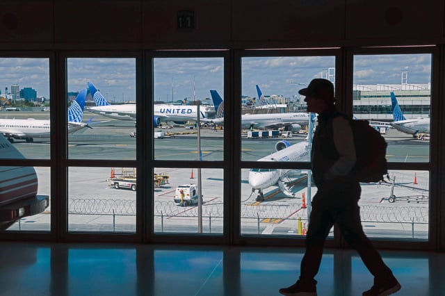 People move through Newark Liberty International Airport in Newark, New Jersey.