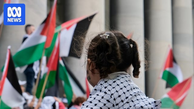 Palestinian flags at a rally.