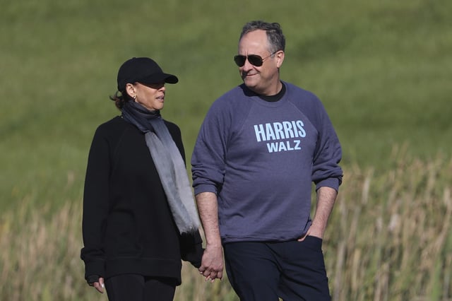 Democratic presidential nominee Vice President Kamala Harris, left, and second gentleman Doug Emhoff are pictured as they take a walk on September 8, 2024. Emhoff told the hosts of The Rest Is Politics: US podcast that Americans “need a strong Republican Party."