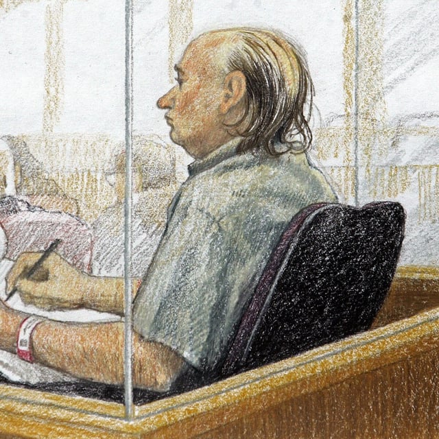 An artist's sketch shows accused serial killer Robert Pickton taking notes during the second day of his trial in B.C. Supreme Court in New Westminster, B.C., Tuesday January 31, 2006. THE CANADIAN PRESS/Jane Wolsack