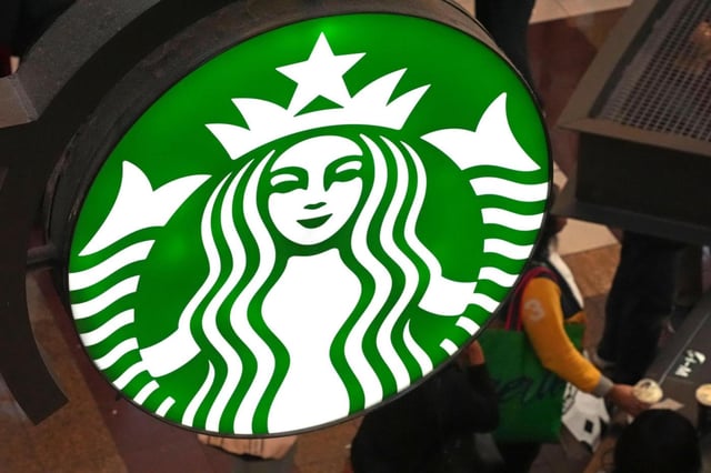 FILE – This is the Starbucks sign on Black Friday shoppers line at a Starbucks kiosk in the Walden Galleria in Buffalo, NY., Friday, Nov. 29, 2024. (AP Photo/Gene J. Puskar, File)
