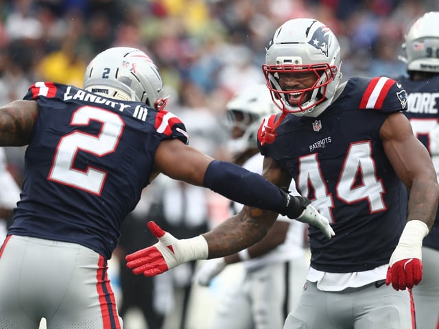 Foxboro, MA - New England Patriots' Harold Landry III and K'Lavon Chaisson celebrate sacking Las Vegas Raiders quarterback Geno Smith during the second quarter of the game at Gillette Stadium. (Nancy Lane/Boston Herald)