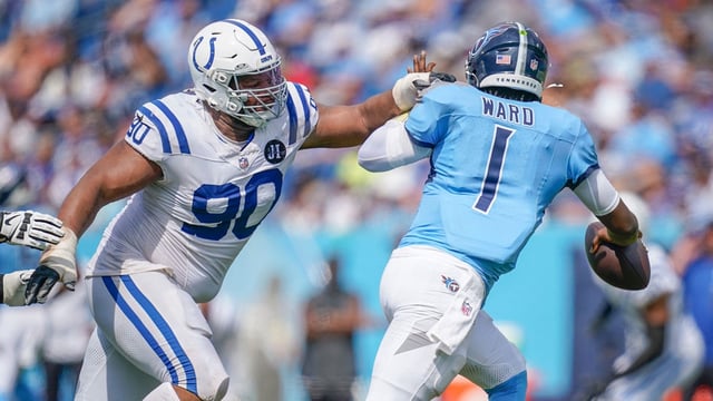Indianapolis Colts defensive tackle Grover Stewart (90) pressures Tennessee Titans quarterback Cam Ward (1) during the third quarter at Nissan Stadium in Nashville, Tenn., Sunday, Sept. 21, 2025.