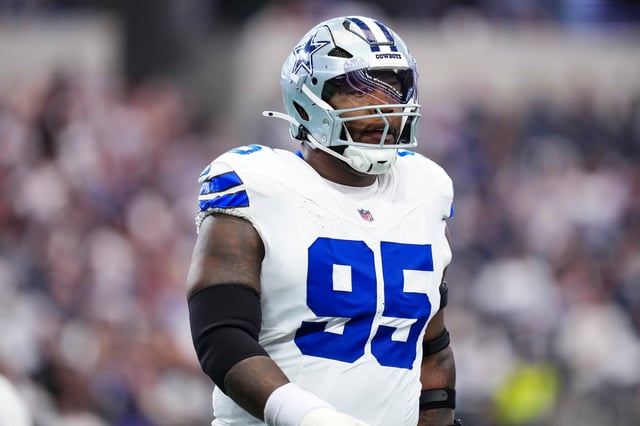 Kenny Clark #95 of the Dallas Cowboys looks on from the field during an NFL football game against the New York Giants at AT&T Field on September 14, 2025 in Arlington, Texas.