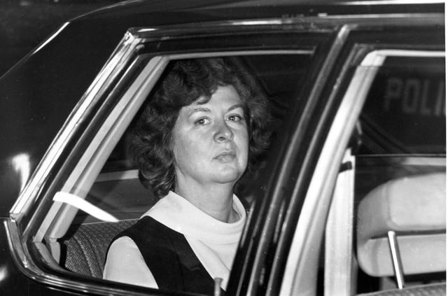 ** FILE ** Sara Jane Moore looks out the window of a U.S. marshal's car in San Francisco, seen in this Dec. 16, 1975, file photo, on her way to the federal court where U.S. District Judge Samuel Conti accepted her plea of guilty to the attempted assassination of President Gerald Ford.