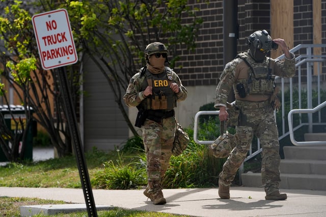 Enforcement and Removal Operations agents walk outside the U.S. Immigration and Customs Enforcement (ICE) building Wednesday, Sept. 24, 2025, in Broadview, Ill. (AP Photo/Erin Hooley)