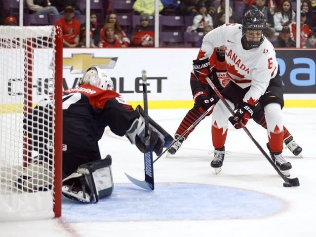 Canada forward Rebecca Johnston (6) takes a shot on Japan goaltender Miyuu Masuhara (30) during second period IIHF Women's World Hockey Championship hockey action in Brampton, Ont., on Saturday, April 8, 2023.