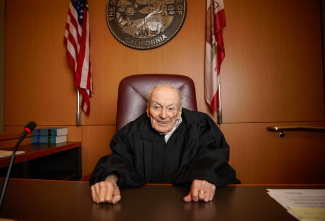 Judge David Gill sits for photo inside his courtroom at the San Diego Central Courthouse downtown on Aug. 21, 2024. (Alejandro Tamayo / The San Diego Union-Tribune)