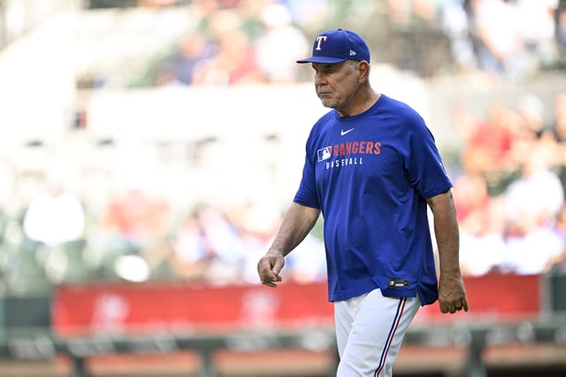 Sep 25, 2025; Arlington, Texas, USA; Texas Rangers manager Bruce Bochy (15) walks to the pitchers mound during the game against the Minnesota Twins at Globe Life Field. Mandatory Credit: Jerome Miron-Imagn Images
