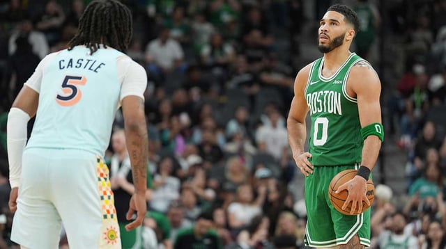Mar 29, 2025; San Antonio, Texas, USA; Boston Celtics forward Jayson Tatum (0) waits for the clock to run out in front of San Antonio Spurs guard Stephon Castle (5) in the second at Frost Bank Center. Mandatory Credit: Daniel Dunn-Imagn Images