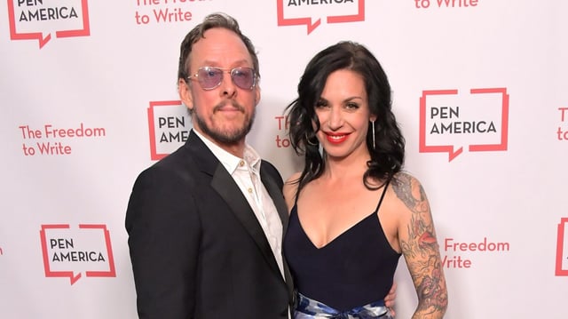 Weezer bassist Scott Shriner and wife Jillian Shriner are seen attending the PEN America 2018 LitFest Gala at the Beverly Wilshire Four Seasons Hotel on Nov. 2, 2018, in Beverly Hills. On April 8, 2025, Jillian Shriner was arrested and booked on attempted murder charges after allegedly pointing a gun at  Los Angeles police officers investigating a chase in Eagle Rock. She was shot and wounded by an LAPD officer. (Photo by Charley Gallay/Getty Images for PEN America)