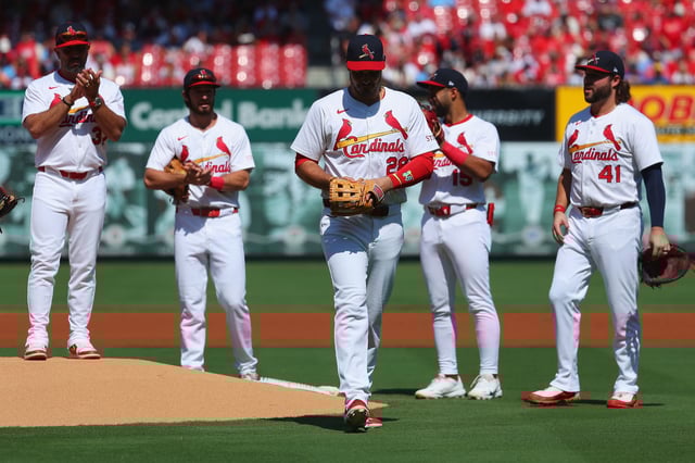 ST LOUIS, MISSOURI - SEPTEMBER 21: Nolan Arenado #28 of the St. Louis Cardinals is ceremoniously removed from the game by manager Oliver Marmol #37 of the St. Louis Cardinals prior to playing against the Milwaukee Brewers at Busch Stadium on September 21, 2025 in St Louis, Missouri. (Photo by Dilip Vishwanat/Getty Images)