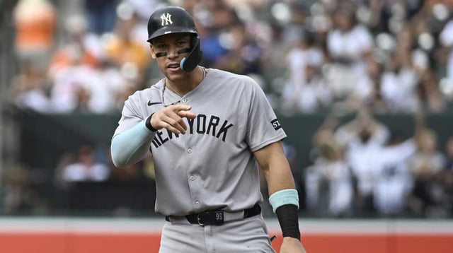 Sep 21, 2025; Baltimore, Maryland, USA; New York Yankees designated hitter Aaron Judge (99) reacts after New York Yankees first base Ben Rice (not pictured) sixth inning rbi single from second base against the Baltimore Orioles at Oriole Park at Camden Yards. Mandatory Credit: Tommy Gilligan-Imagn Images