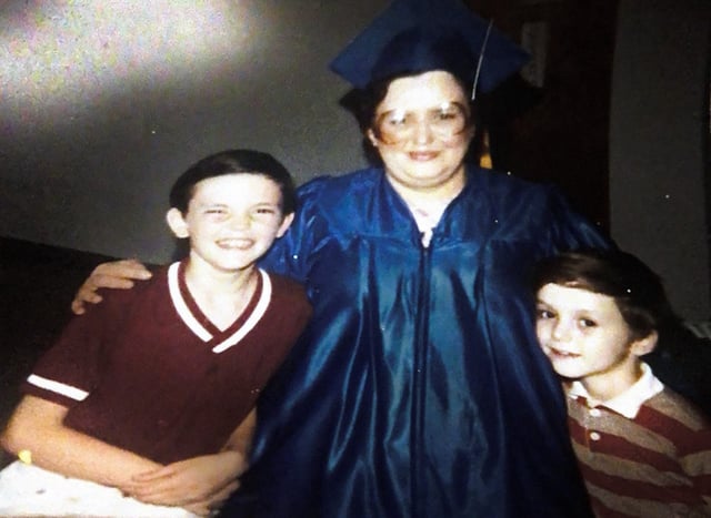 Margaret “Maggie” Berry embraces her sons Andrew (left) and Will (right) in this photo taken after Berry earned her GED. Berry was killed in a robbery of convenience store where she worked in 1997.