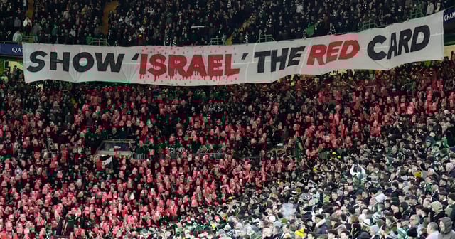 Celtic fans unveil an anti-Israel banner in the stands during a match. PA