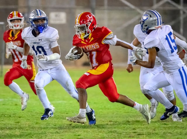 Loara running back Santiago Caudillo, center, finds an opening in the Century defense in a nonleague football game in Anaheim on Thursday, September 25, 2025. (Photo by Paul Rodriguez, Contributing Photographer)