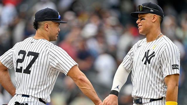 Sep 7, 2025; Bronx, New York, USA; New York Yankees designated hitter Giancarlo Stanton (27) celebrates with New York Yankees right fielder Aaron Judge (99) after the game against the Toronto Blue Jays at Yankee Stadium. Mandatory Credit: Mark Smith-Imagn Images.