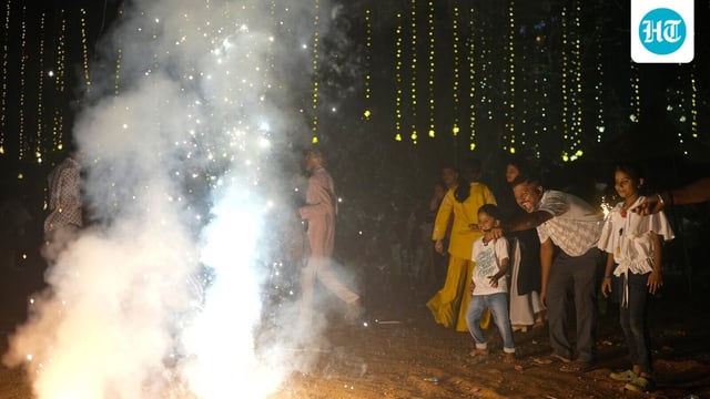 People light fire crackers during Diwali, the festival of lights 