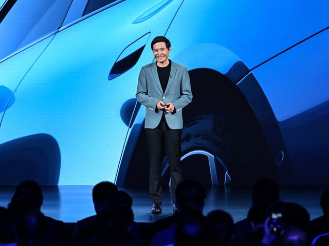 Xiaomi CEO Lei Jun launches the SU7 EV in Beijing.