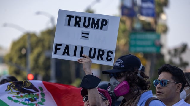 People protest in downtown Los Angeles in response to immigration raids in June 2025. Photo: David McNew/Getty Images
