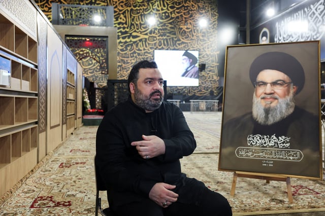 Jawad Nasrallah, son of late Hezbollah leader Hassan Nasrallah, reacts at the burial site ahead of the first anniversary of his father's assassination, on the outskirts of Beirut, Lebanon September 24, 2025. REUTERS/Mohamed Azakir