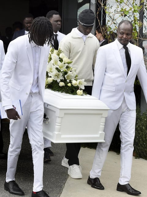 Family and friends gather at St Marys Anglican Church, Sunbury for the funeral of Chol Achiek, 12, who was killed in a machete attack at Cobblebank. Andrew Henshaw
