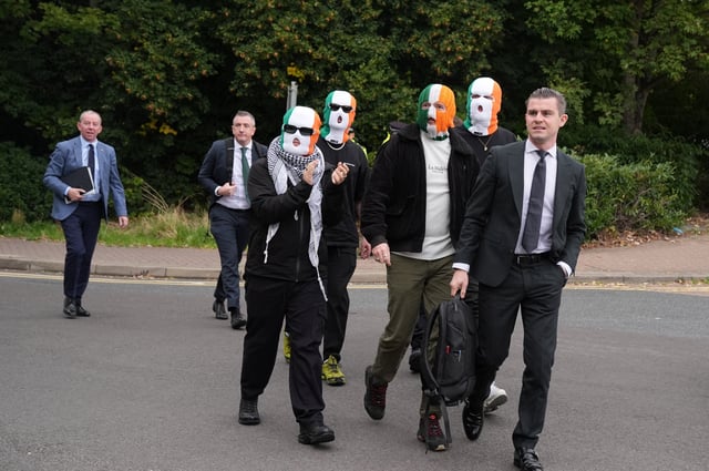 Member of the rap group Kneecap, Liam O'Hanna, also known as Liam Og O hAnnaidh and performing under the name of Mo Chara, who has been charged with a terrorism offence in relation to the alleged display of a Hezbollah flag onstage in 2024, walks outside the Woolwich Crown Court on the day of a hearing, in London, Britain, September 26, 2025. REUTERS/Maja Smiejkowska