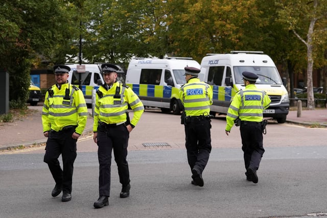 Police officers walk outside the Woolwich Crown Court ahead of the hearing of Kneecap member Liam O'Hanna, also known as Liam Og O hAnnaidh and performing under the name of Mo Chara, who has been charged with a terrorism offence in relation to the alleged display of a Hezbollah flag onstage in 2024, in London, Britain, September 26, 2025. REUTERS/Maja Smiejkowska